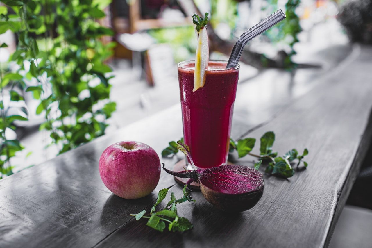 natural-apple-and-beetroot-smoothie-served-on-table-of-4551975