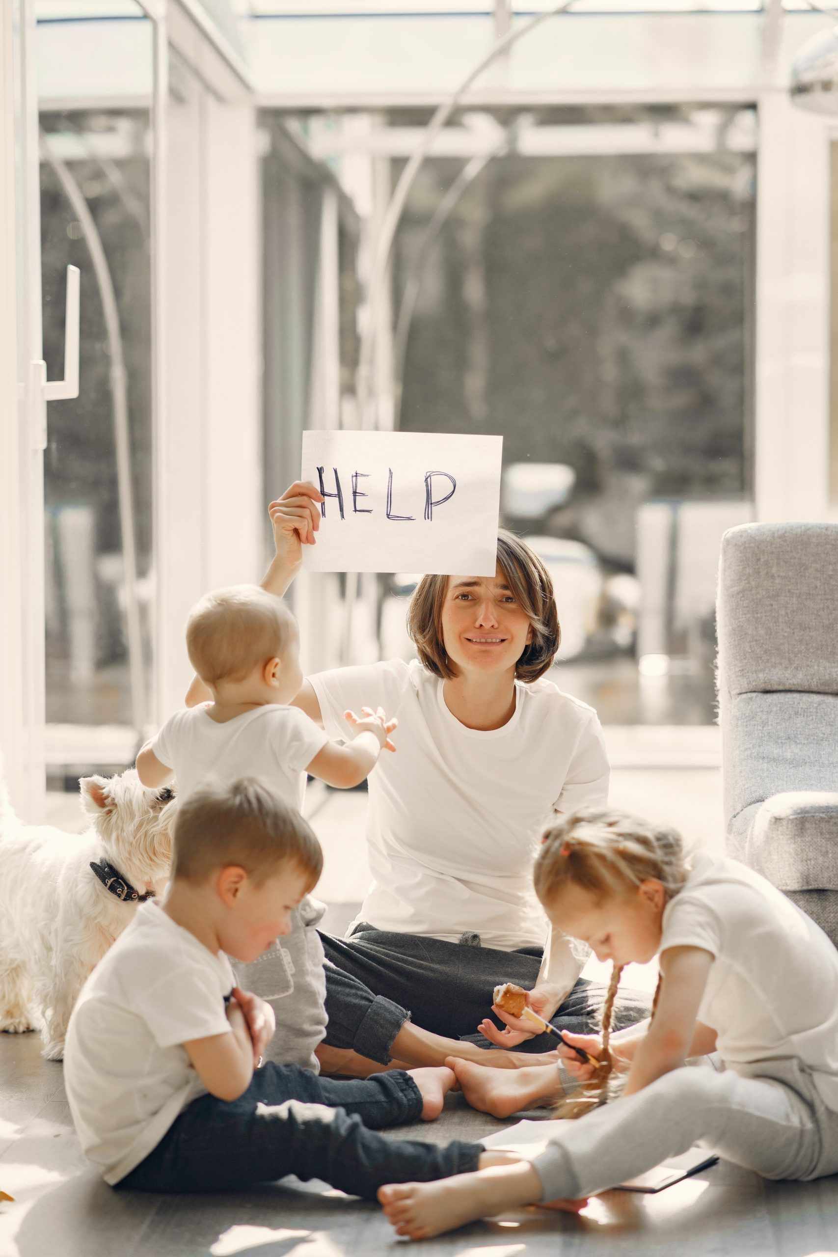 tired-mother-asking-for-help-while-sitting-with-children-4017419